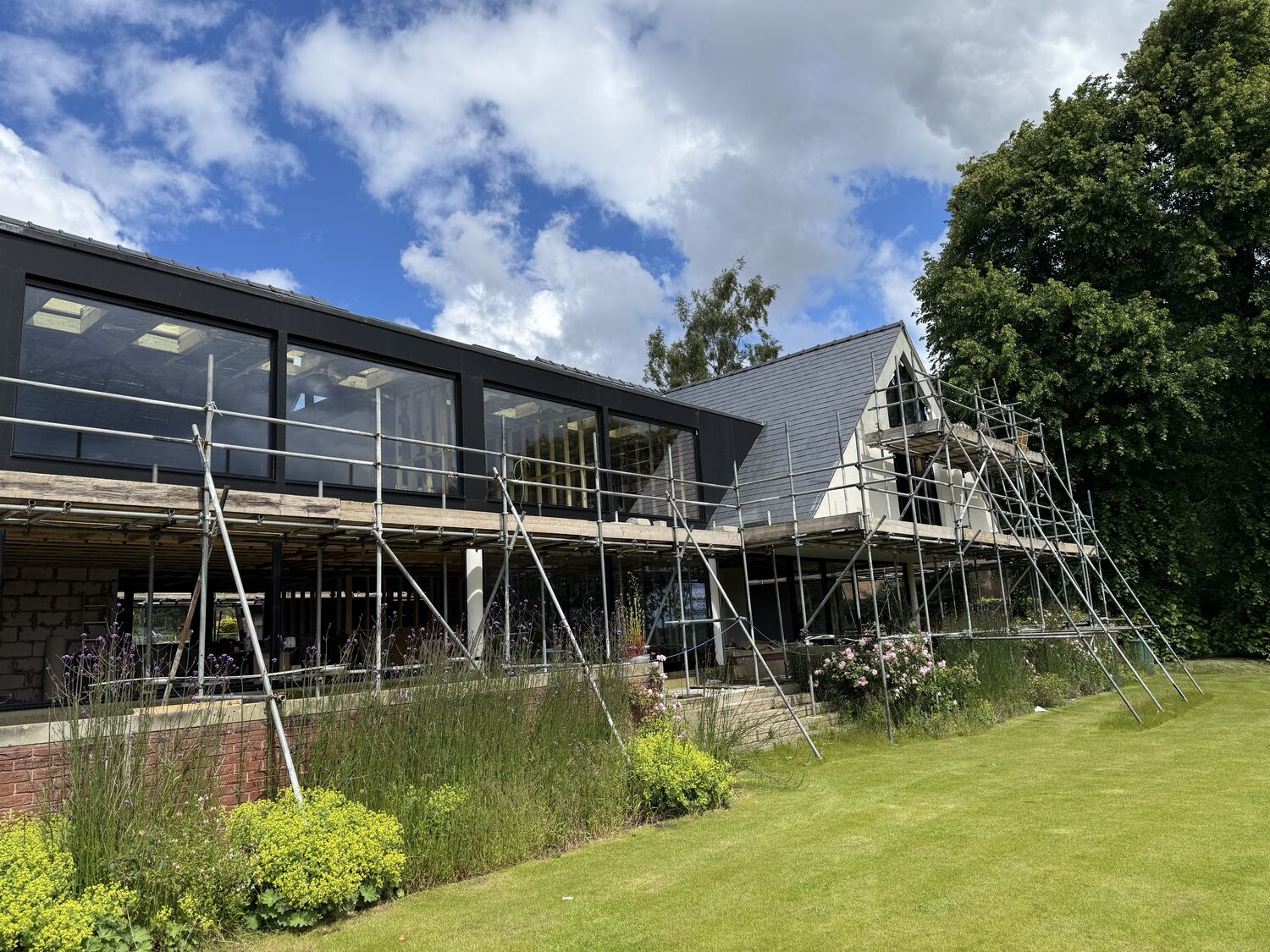 Exterior mid-build under scaffold